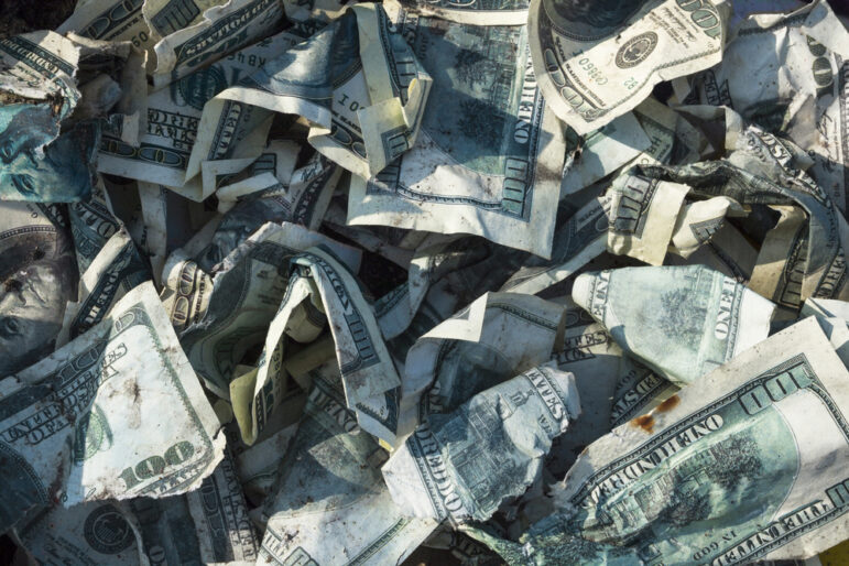 pile of crumpled dirty money laundering