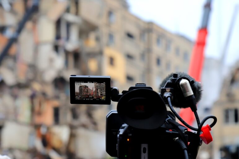 news camera independent journalist reporting